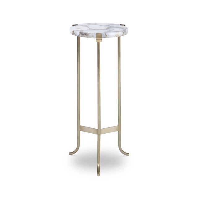 A classic base of solid brass in a lightly antiqued finish supports a round top of cut agate. Assembly Required? No Care...