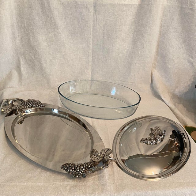 Very pretty and ornate covered server with cast grapes on the lid and handles. Great way to serve a hot dish with a...