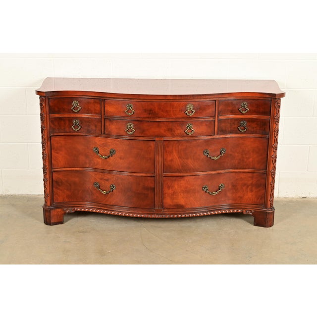 An exceptional Chippendale or Georgian style serpentine front ten-drawer dresser or chest of drawers By Century Furniture...