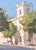 12 Downing Morning by Judd Mercer | Gouache Painting of a building with trees and pedestrians For Sale