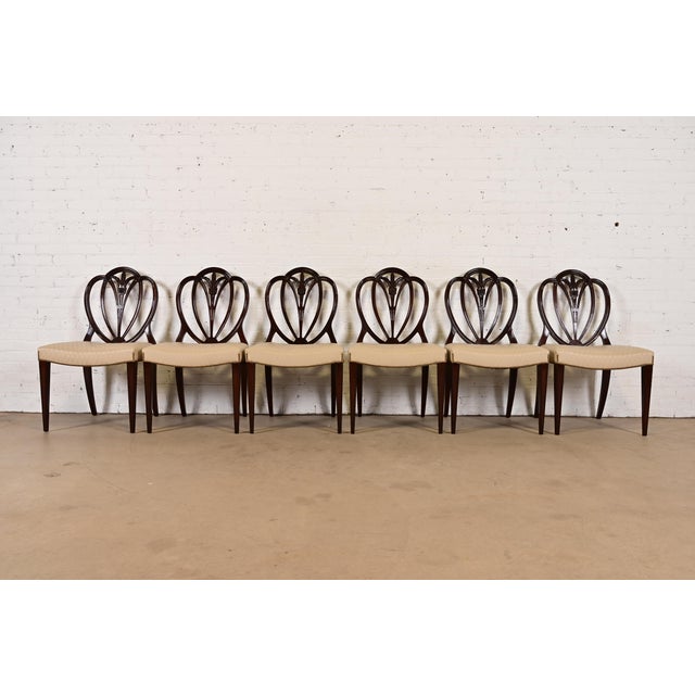 A gorgeous set of six Georgian or Regency style shield back side chairs or dining chairs In the manner of Baker Furniture...