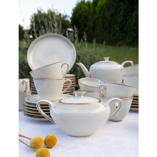 The white base porcelain was manufactured in Germany by the Frisia firm, and subsequently imported and hand-decorated in...