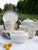 The white base porcelain was manufactured in Germany by the Frisia firm, and subsequently imported and hand-decorated in...