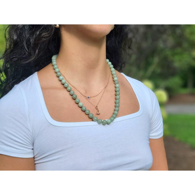 This exquisite necklace features nephrite from New Zealand, sourced from the renowned company Tuarangi Jade Jewellery. In...