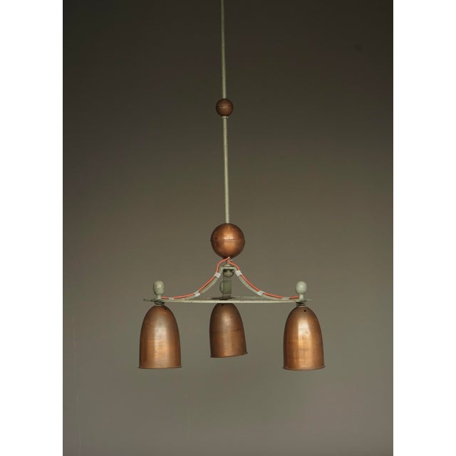 Large iron and copper lights that come from a mid-century church interior in the Dutch town of Heusden. The church was an...