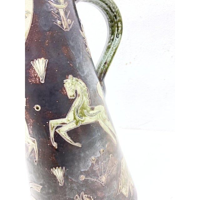 Large floor vase (jug) from the 70s with plant and animal motifs by Bernhard Erning. City wages. Ceramics. 52x23cm This...