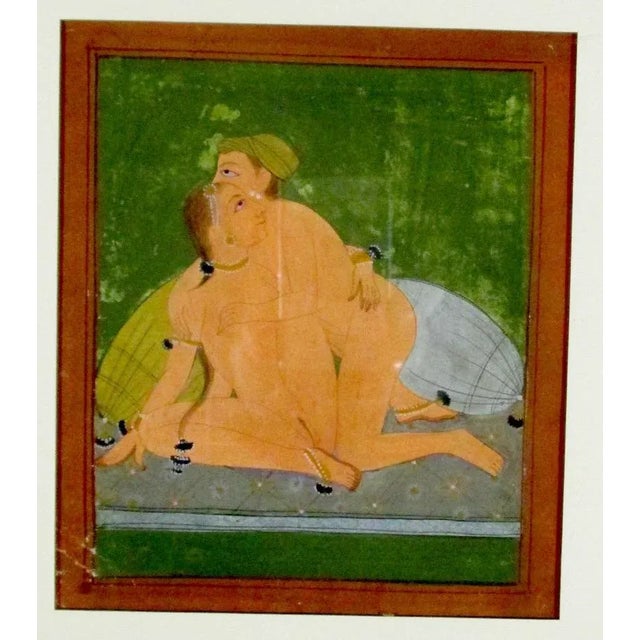 Fine gauche of two lovers in an intimate embrace. Beautifully matted and framed, the image is colored in deep rose and...