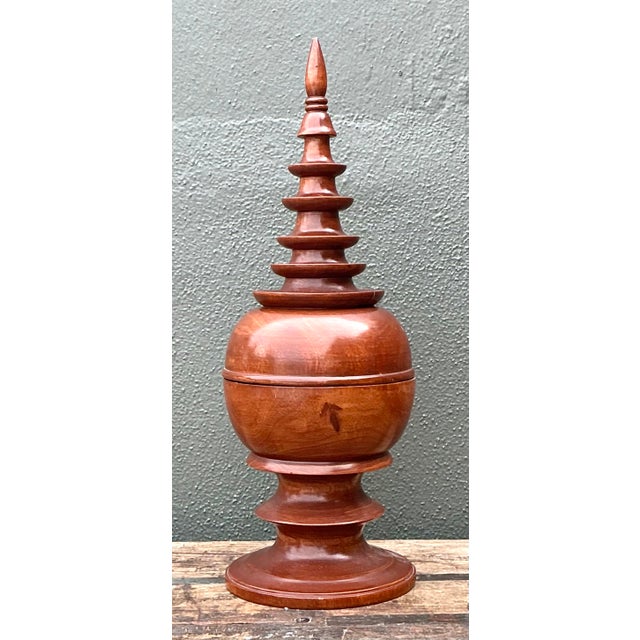 This striking vintage turned wood spire box is a masterclass in sculptural form and artisan woodcraft. Featuring an...