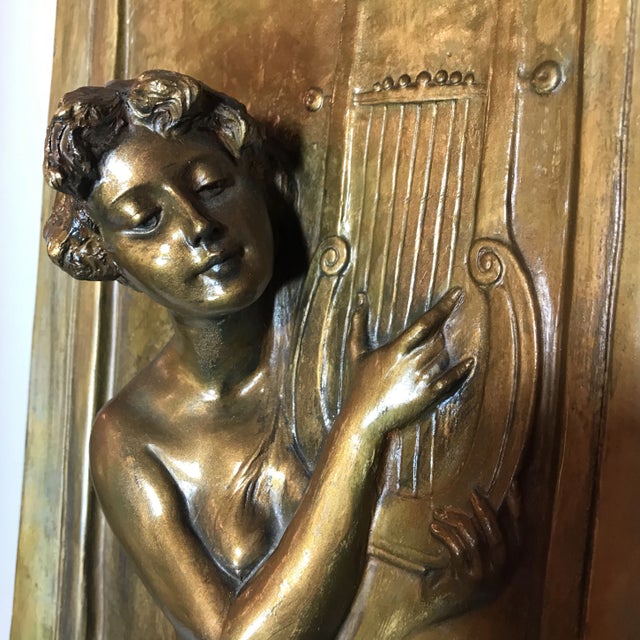 Art Nouveau ceramic handpainted vase with rectangular opening. Depicts woman playing a lute on the side and is engraved...