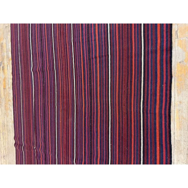 this mid-20th-century Turkish Decorative textile is a beautiful testament to Anatolian tribal weaving craftsmanship....