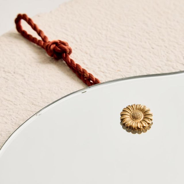 Organic shaped mirror from the 1970s, with some surface scratches and wear.