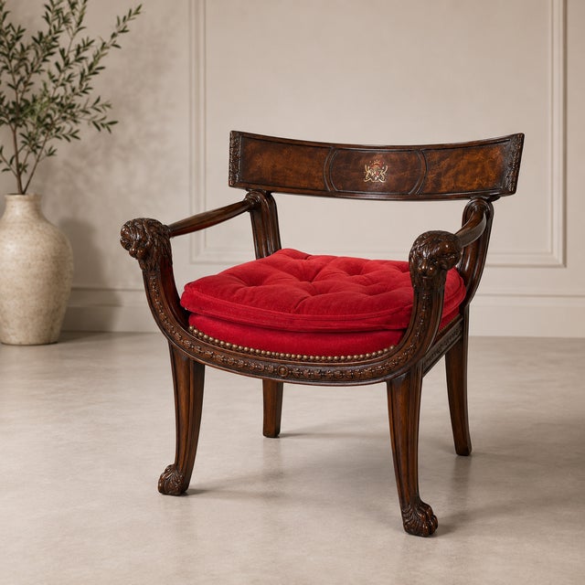 This is the Theodore Alexander interpretation of a Thomas Hope classic. An English Regency-style mahogany armchair, the...