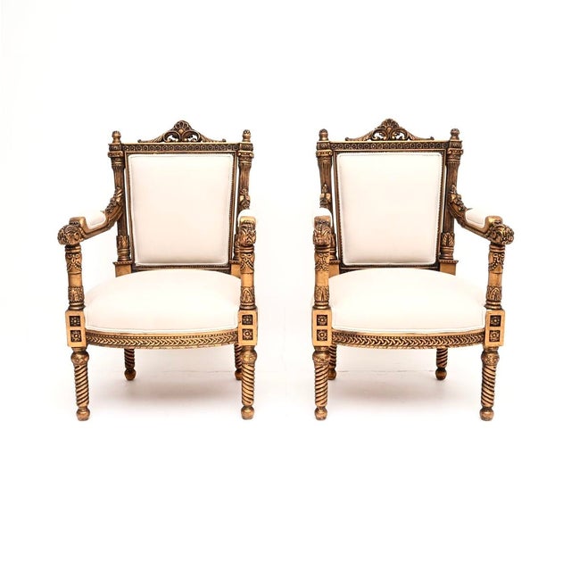 A beautiful pair of antique French Louis style carved gilt wood armchairs, dating from around the 1930’s. They are...