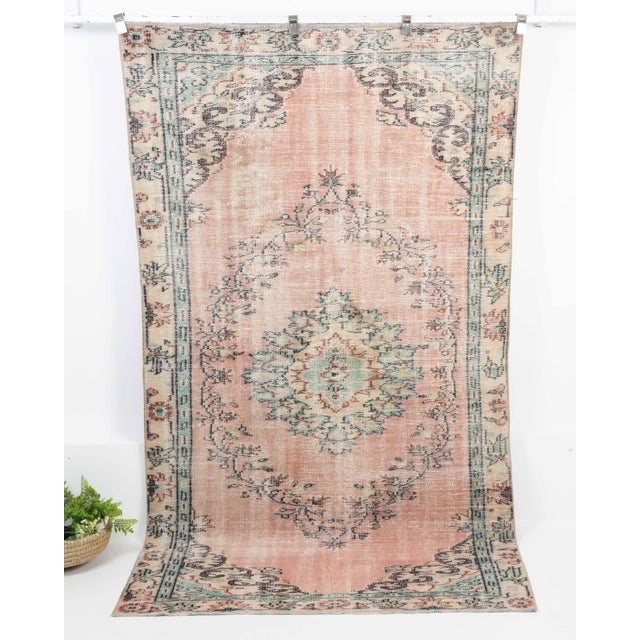 Vintage Turkish Hand-Knotted vintage rug is a semi-antique vintage Area rug.'70s Eastern region of Turkey's unique rug is...
