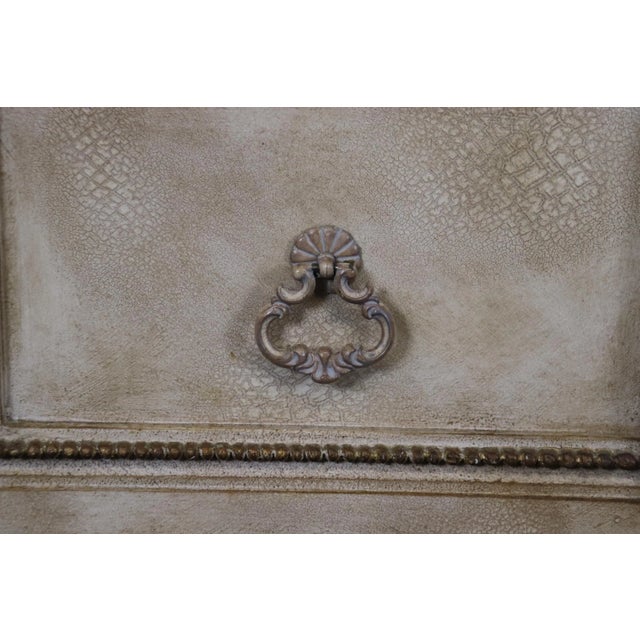 This is a beautiful commode done in the renaissance style with a paint decorated and gilded with metal hardware. The color...