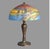 An antique Arts and Crafts table lamp with domed glass shade having a textured exterior and reverse painted interior...