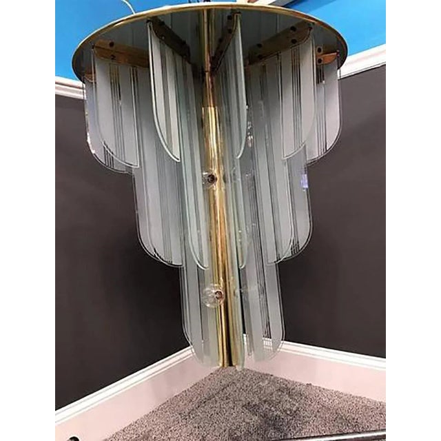 Beautiful etched and frosted panel fountain form flush mount chandelier with polished brass frame. Great quality with...