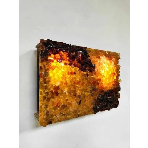 Glow! This vintage glass wall lamp "Glowing Amber" is a real mood-setter. The unique broken glass catches the light...