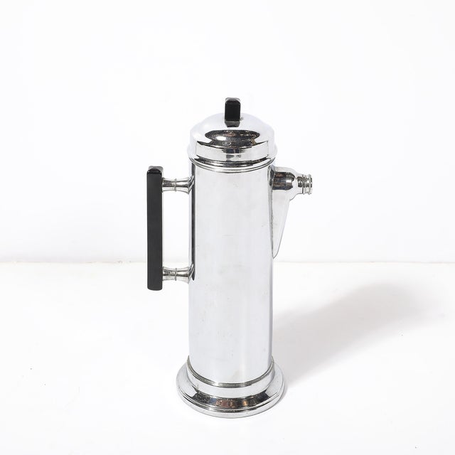 This stunning Art Deco cocktail shaker, crafted in America circa 1935, exemplifies the sleek and modern aesthetic of the...