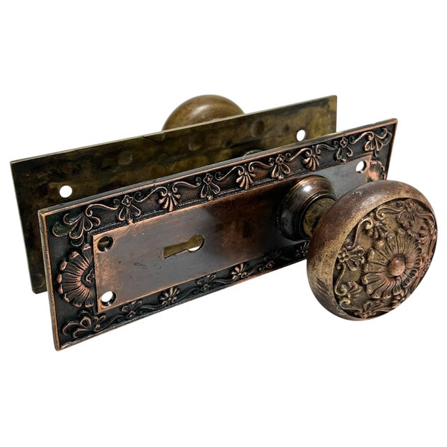 Add a finishing touch to your favorite door with this eclectic and sophisticated pair of American bronze door knobs with...