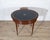 Refined and unusually versatile Louis XVI–style oval table in mahogany and mahogany veneer, dating from the 19th century....