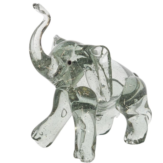 Grace caught mid-stride, this hand blown Murano elephant bears the breath of Venice in its folds. A creature sculpted from...