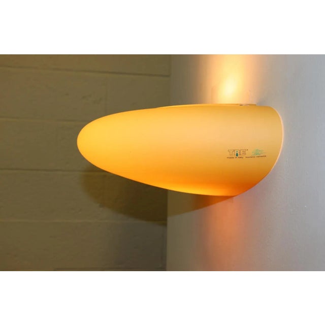 "Mezzo Atollo 46" Wall Lamp Murano Hand Blown "Incamiciato" Amber Glass, Satin Finish and White Interior. Designed by...