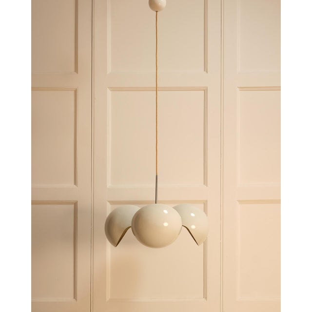 Olaf von bohr pendant light - artemide, 1970s composition of two overlapping, crossed spherical pairs in white lacquered...