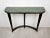A very elegant and organic wall mount console table, original green marble top, wooden frame, tapered legs with brass...