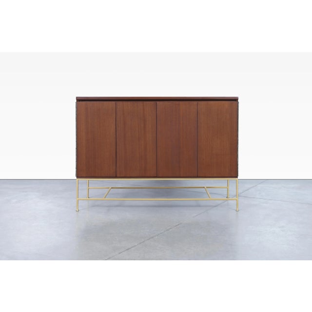 Beautiful vintage “Irwin Collection” mahogany and brass credenza by Paul McCobb for Calvin Furniture, manufactured in the...