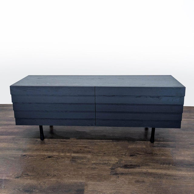 This modern black dresser features six spacious drawers, perfect for organizing clothes or other items. The horizontal...