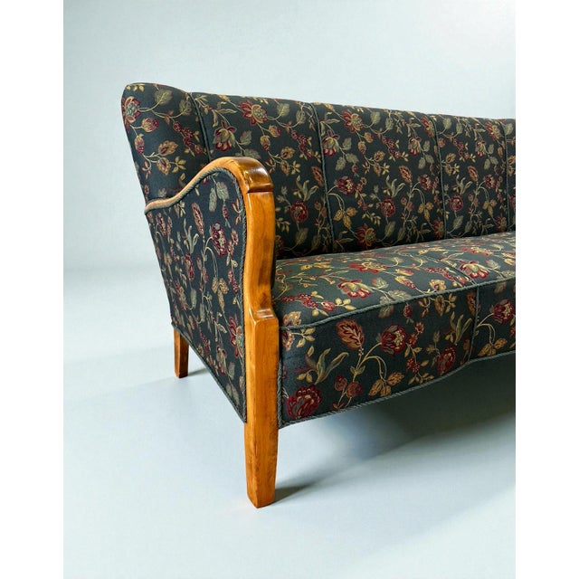 Timeless Danish modern three-seater sofa from the 1960s, crafted by a Danish cabinetmaker. Made of beech wood with the...