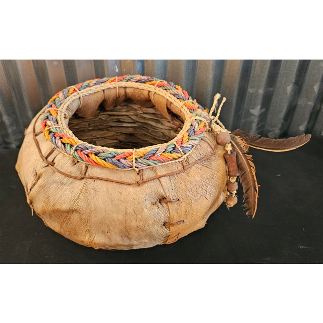 Vintage Native American Style Handwoven Fiber Basket with Feather & Beaded Details A wonderfully rustic vintage handwoven...