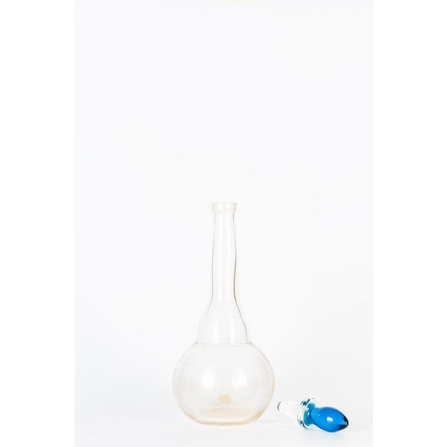 Jean Mell glass bottle is a beautiful glass decorative object, realized by Murano manufacture during the 1970s and...