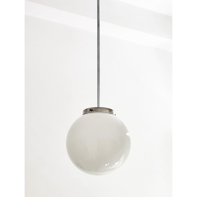 Antique globe light from the 1930s Chrome-plated rod and shade, frosted glass globe New socket, rewired. All other parts...