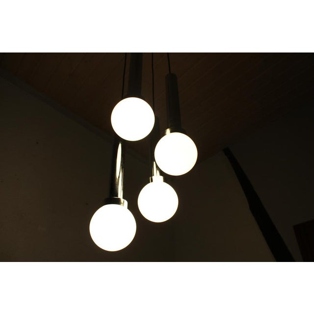 70s cascade suspension light This is a chandelier that will have a place of choice in your interior. with its 4 Opalin...