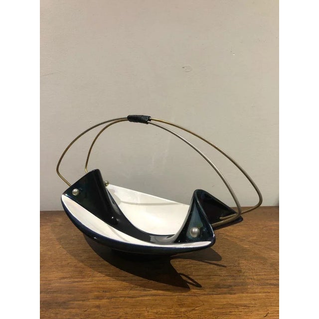 Ceramic bowl from the late 50's in black and pearly white. This piece has an attribution mark, I am sure that it is...