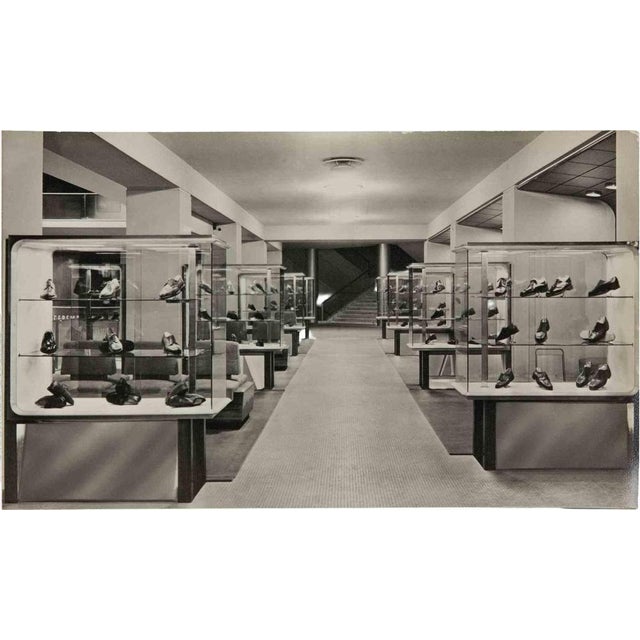 Vintage black and white photograph showing the interior of a fashion salon, most probably the NK Department Store...