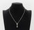 14K White Gold, Tahitian Pearl, and Diamond Necklace and Earrings Set, featuring one necklace with fixed pendant decorated...
