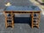 A striking vintage desk by Milling Road for Baker Furniture, blending Hollywood Regency and British Colonial influences...