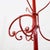 Red metal freestanding coat rack featuring curved hooks.