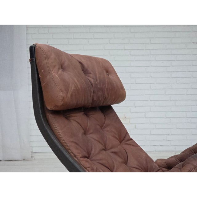 1970s, Swedish design by Bruno Mathsson, model "Pernilla". Original very nice patinated brown furniture leather, bent...