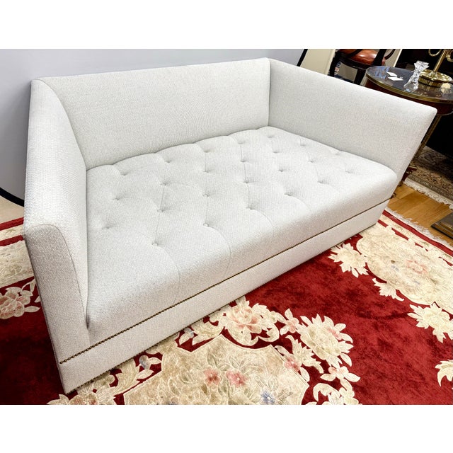 Elevate your living space with this stunning mid-century modern style Kindel sofa, boasting a clean geometric shape. It is...