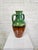 Stunning early 20th-century French glazed ceramic vessel. Featuring a classic amphora silhouette with traditional twin...