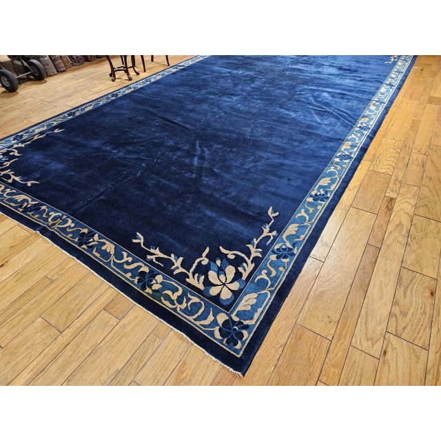 Discover timeless elegance with this oversized Art Deco Chinese rug from the early 20th century—a rare and exceptional...