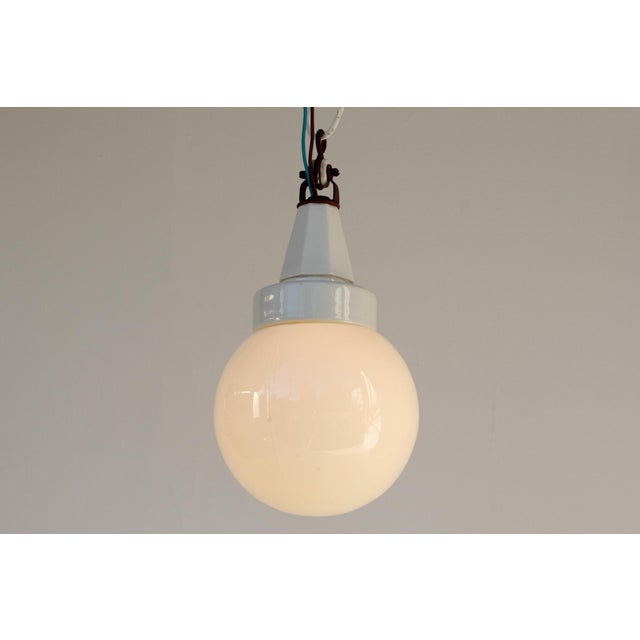 Geometric porcelain ceiling light with an opal glass shade. germany or austria, circa 1920. the light requires an e27 (us...