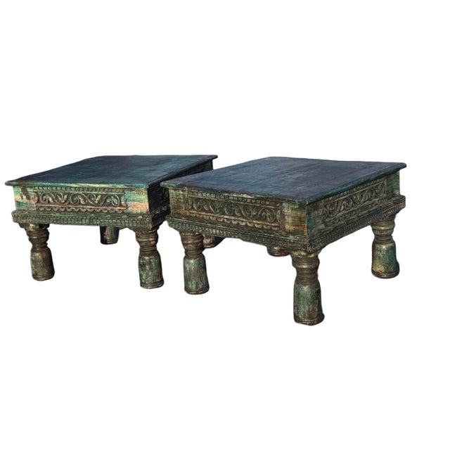 Vintage Indian Teakwood low side tables. These tables feature a warn decorative hand carved scroll design , low turned...