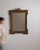 A mirror whose dark bronze ornate carved frame with crest gives it real character at first glance. It was made in France...