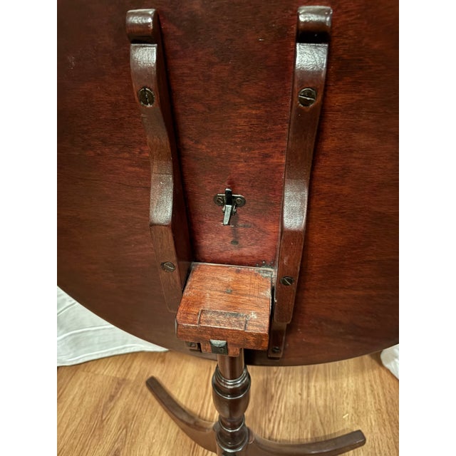 Antique mahogany tilt top tripod, English table dating to the Georgian or Regency era. Constructed of mahogany circular...