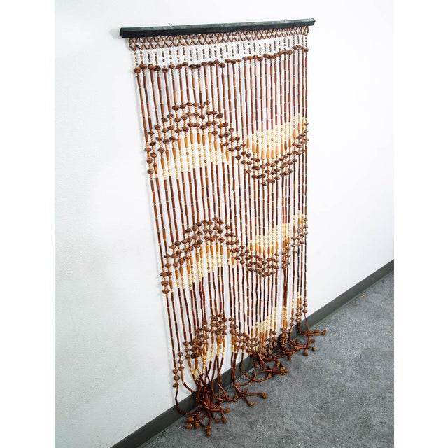Vintage bead curtain in tan and brown with walnut seen throughout Unique and well made.